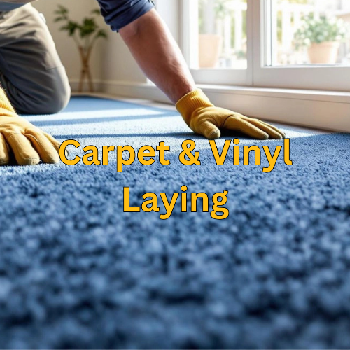 Person laying blue carpet with text 'Carpet & Vinyl Laying' in a room with a window.